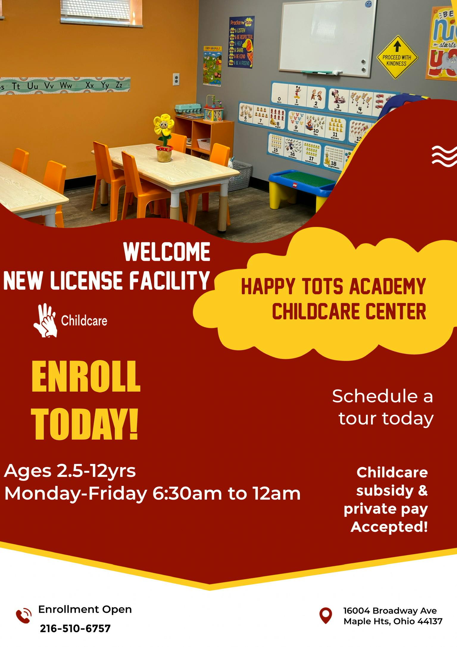 Childcare classroom with small tables and chairs, alphabet chart on wall