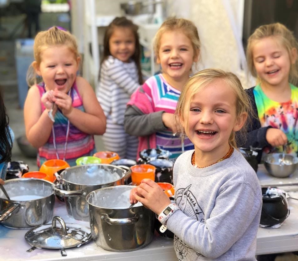 Children playing with pots and bowls