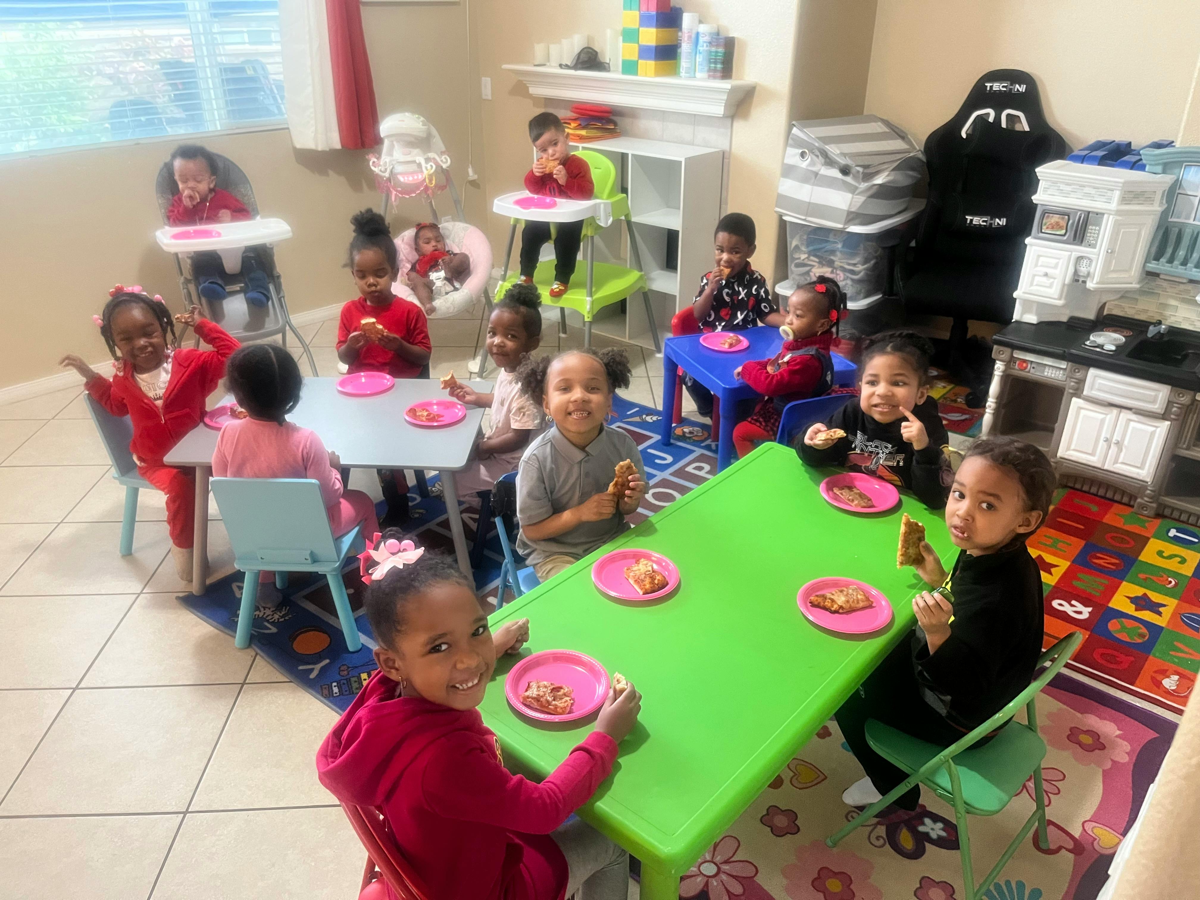Children sitting at tables in a classroom