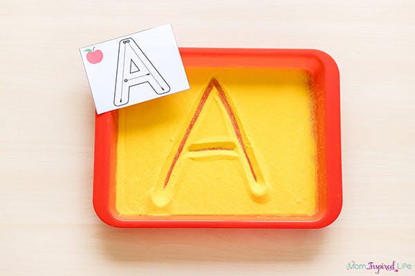 Letter A tracing board with a card showing how to trace the letter A