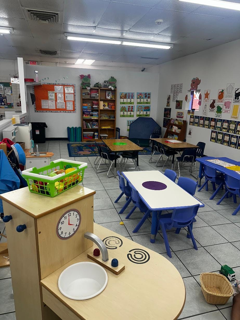 Classroom interior with small tables and chairs for children