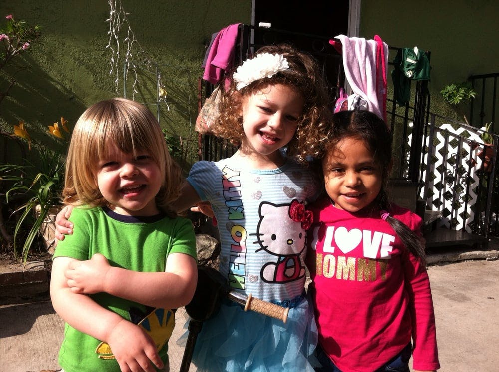 Three children standing together