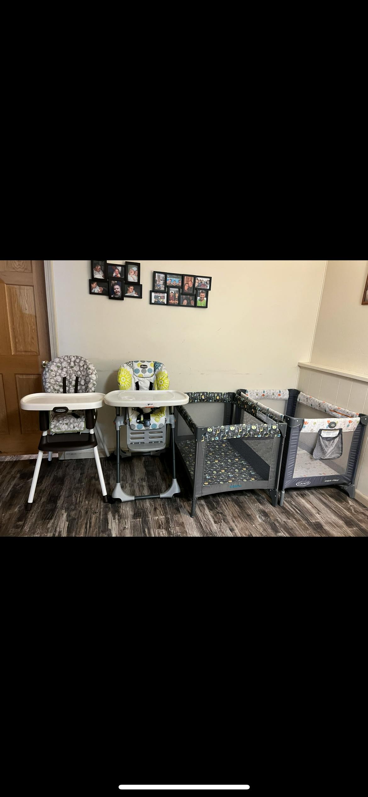 Two high chairs and two playards on a wooden floor
