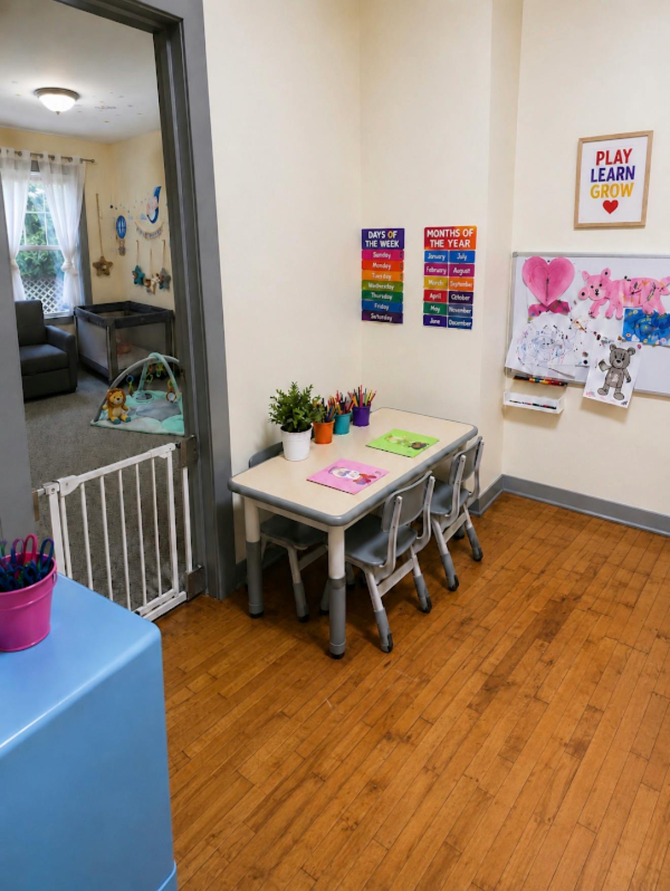 Child-sized table and chairs in a classroom with educational posters