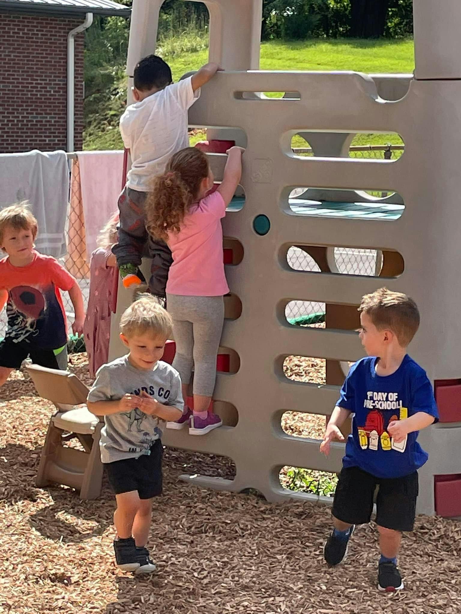 Children playing on a climbing structure on a playground