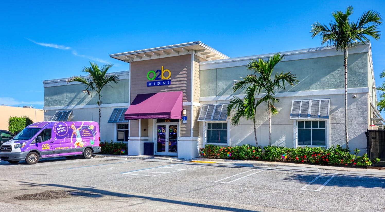 O2B Kids building with purple van in front