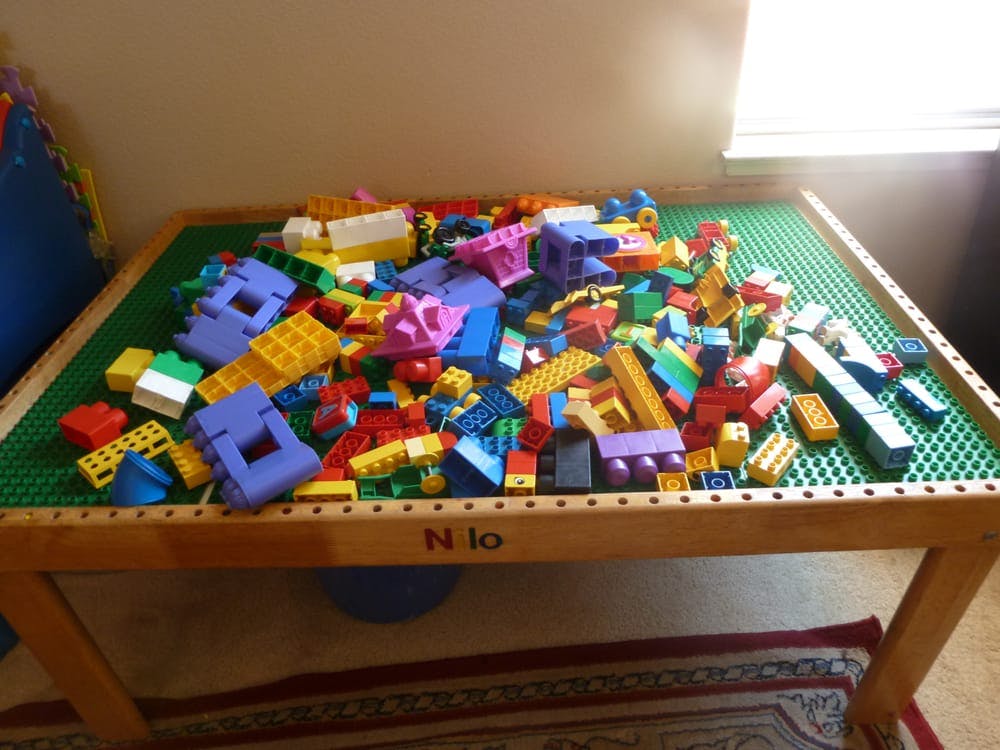 Pile of colorful building blocks on a play table