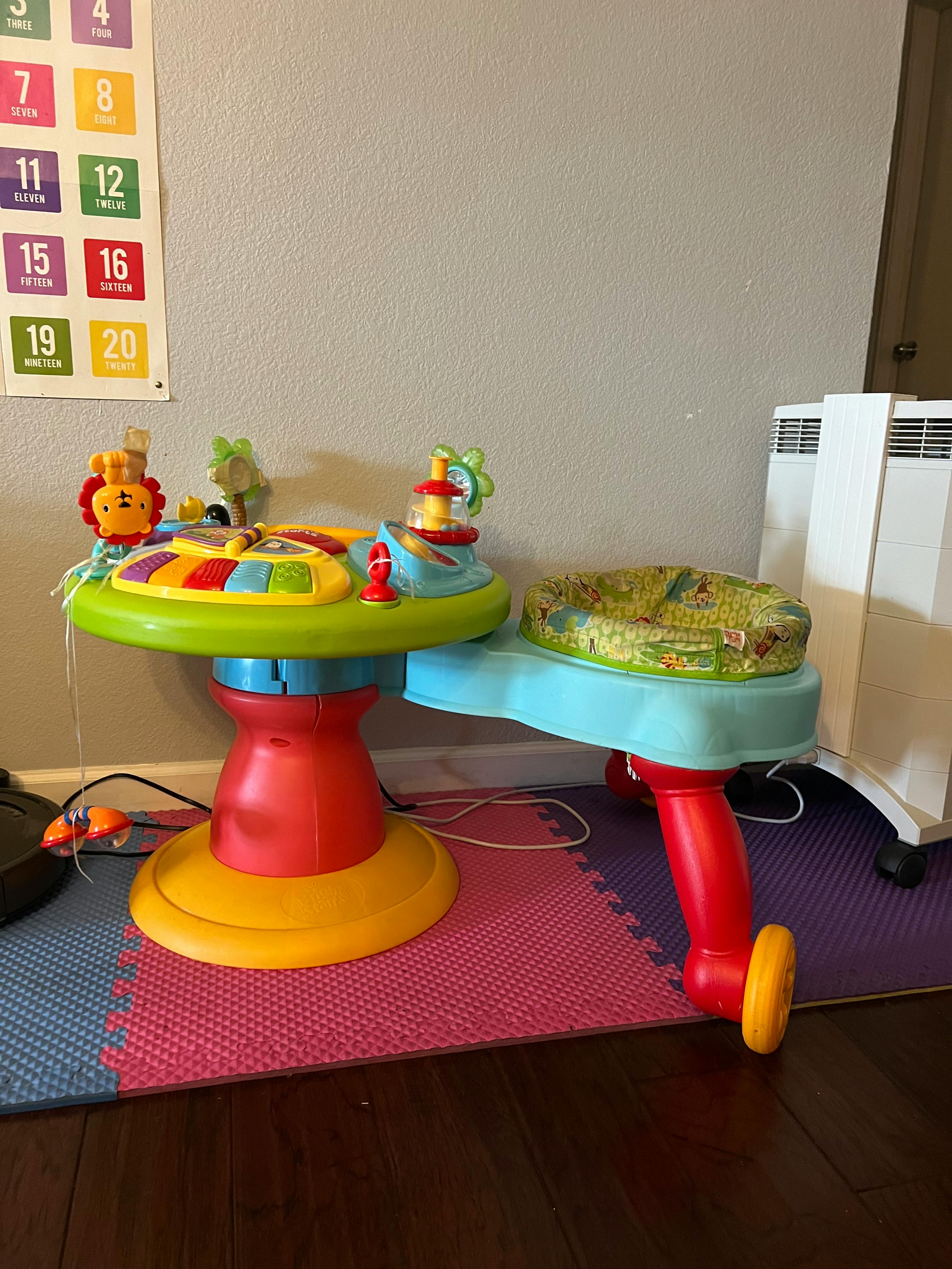 Colorful baby activity center with a seat and toys