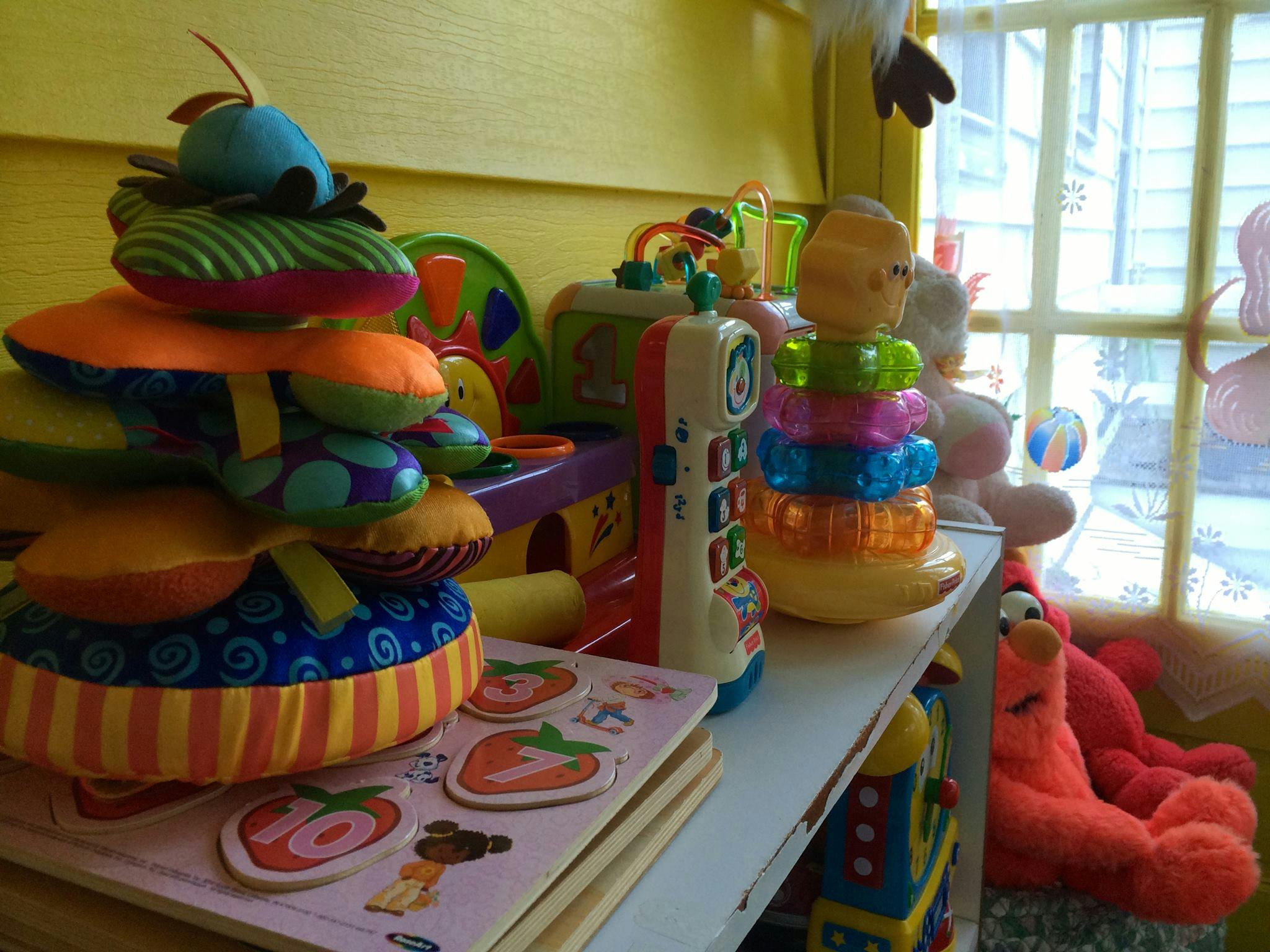 Assortment of colorful children's toys on a shelf