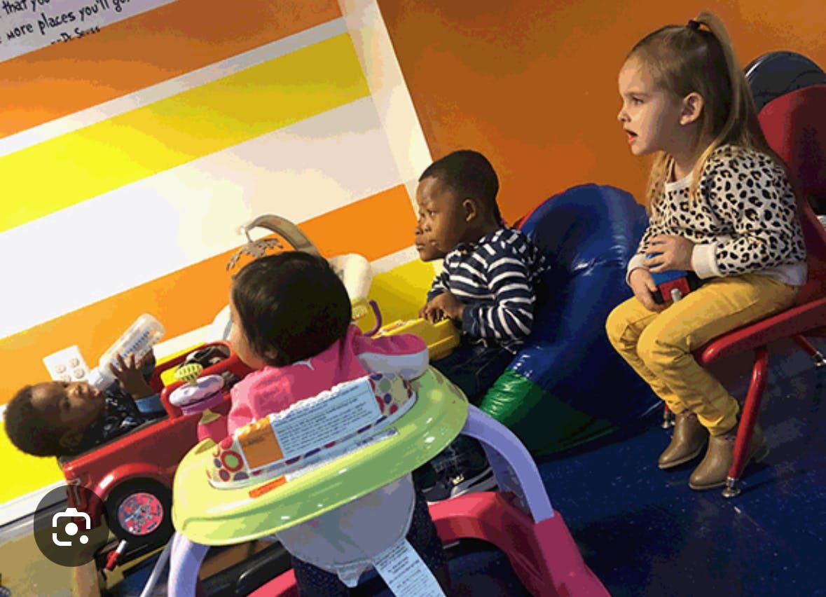 Three children playing with toys