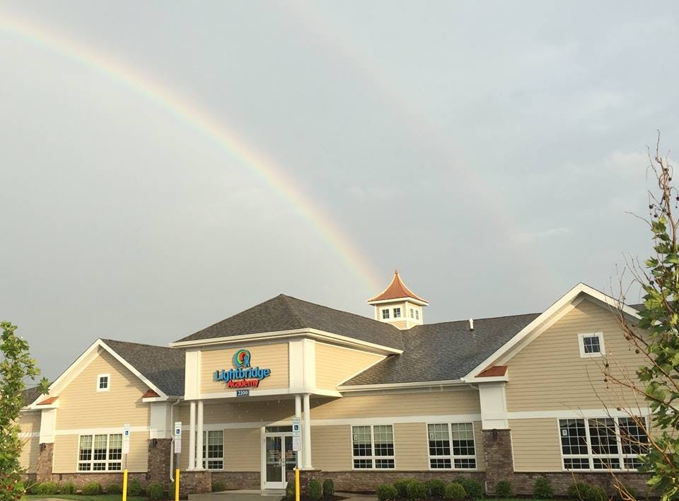 Building with a rainbow in the sky