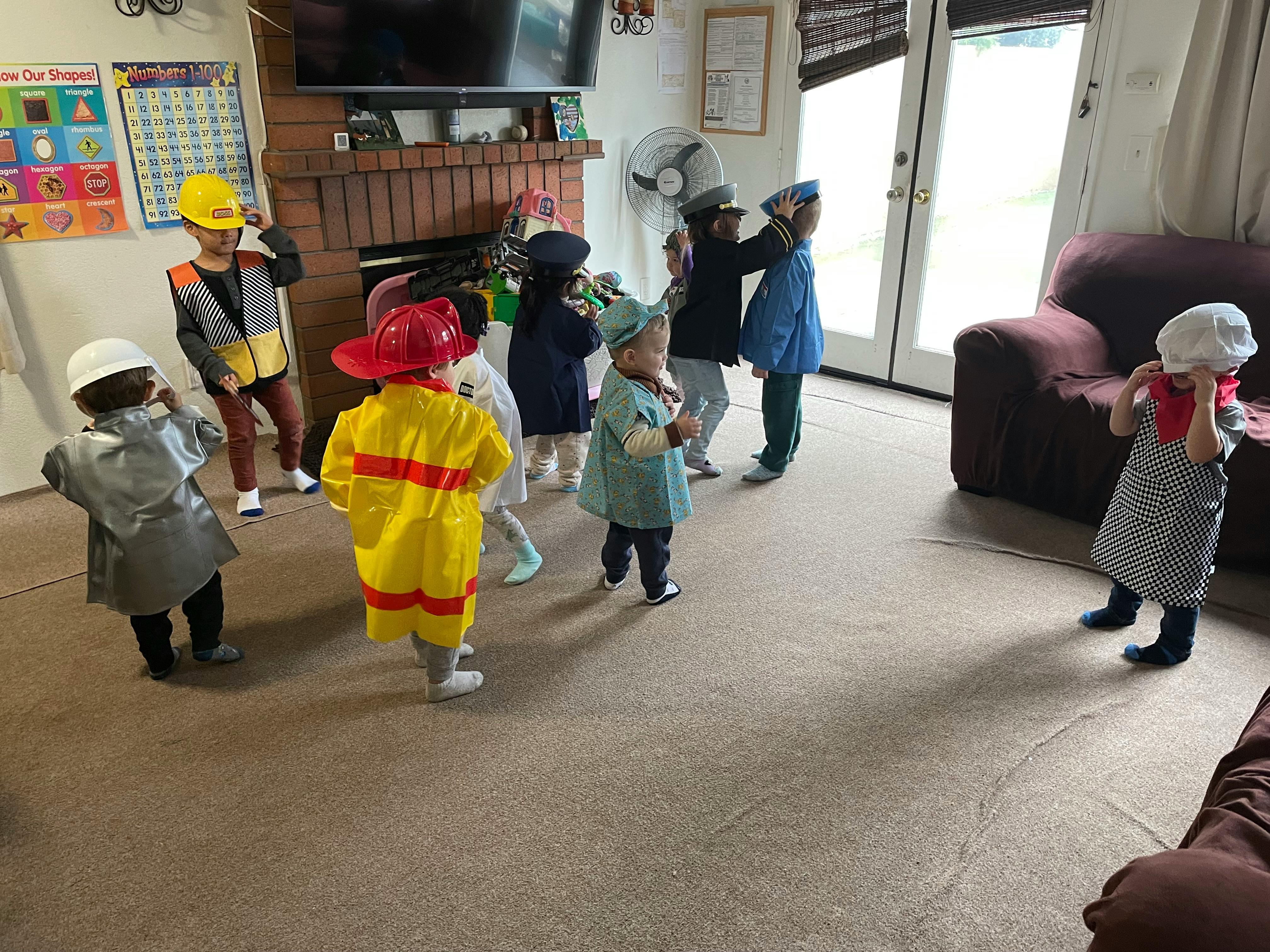 Children in various costumes playing indoors