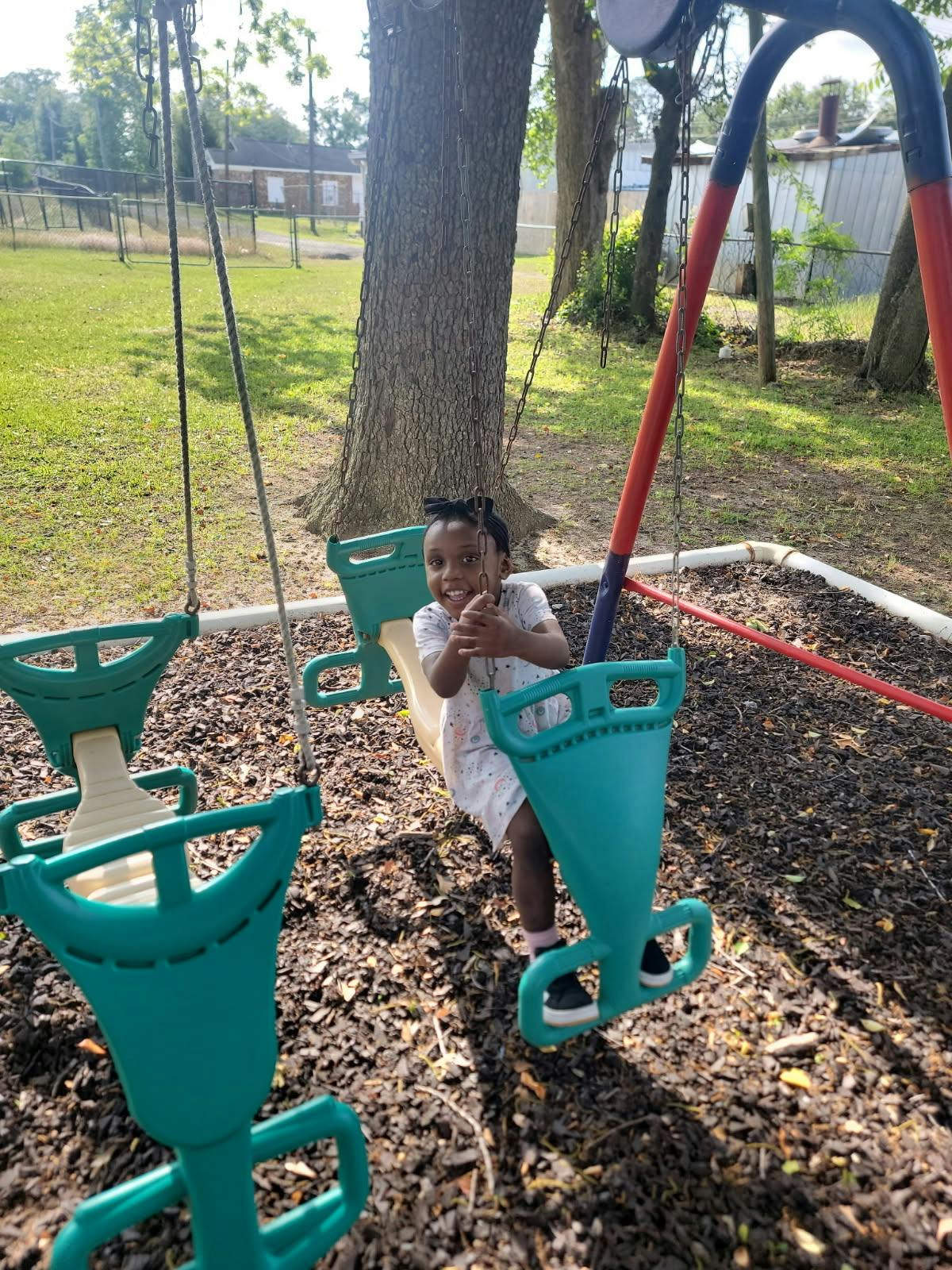 Child on a swing at a playground