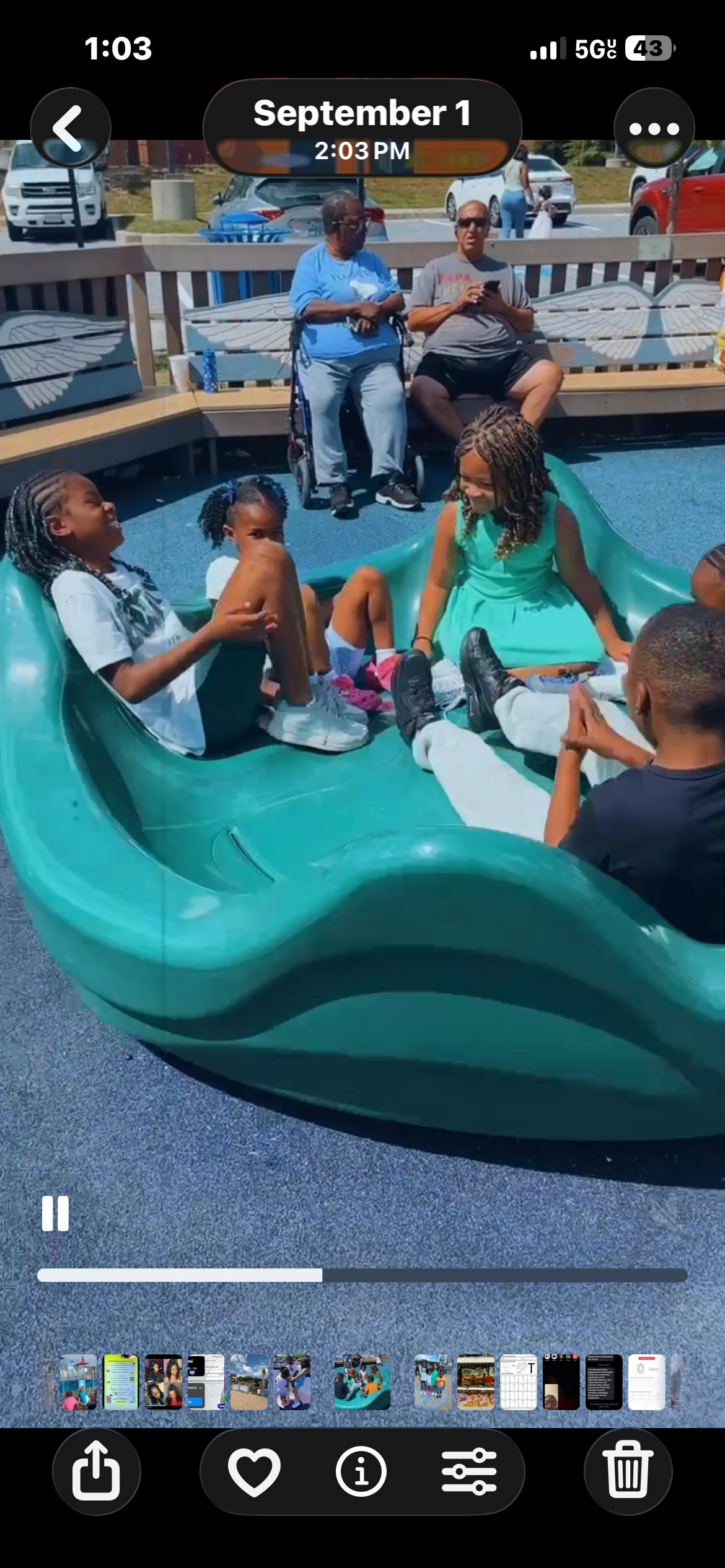 Children and adults on a playground slide