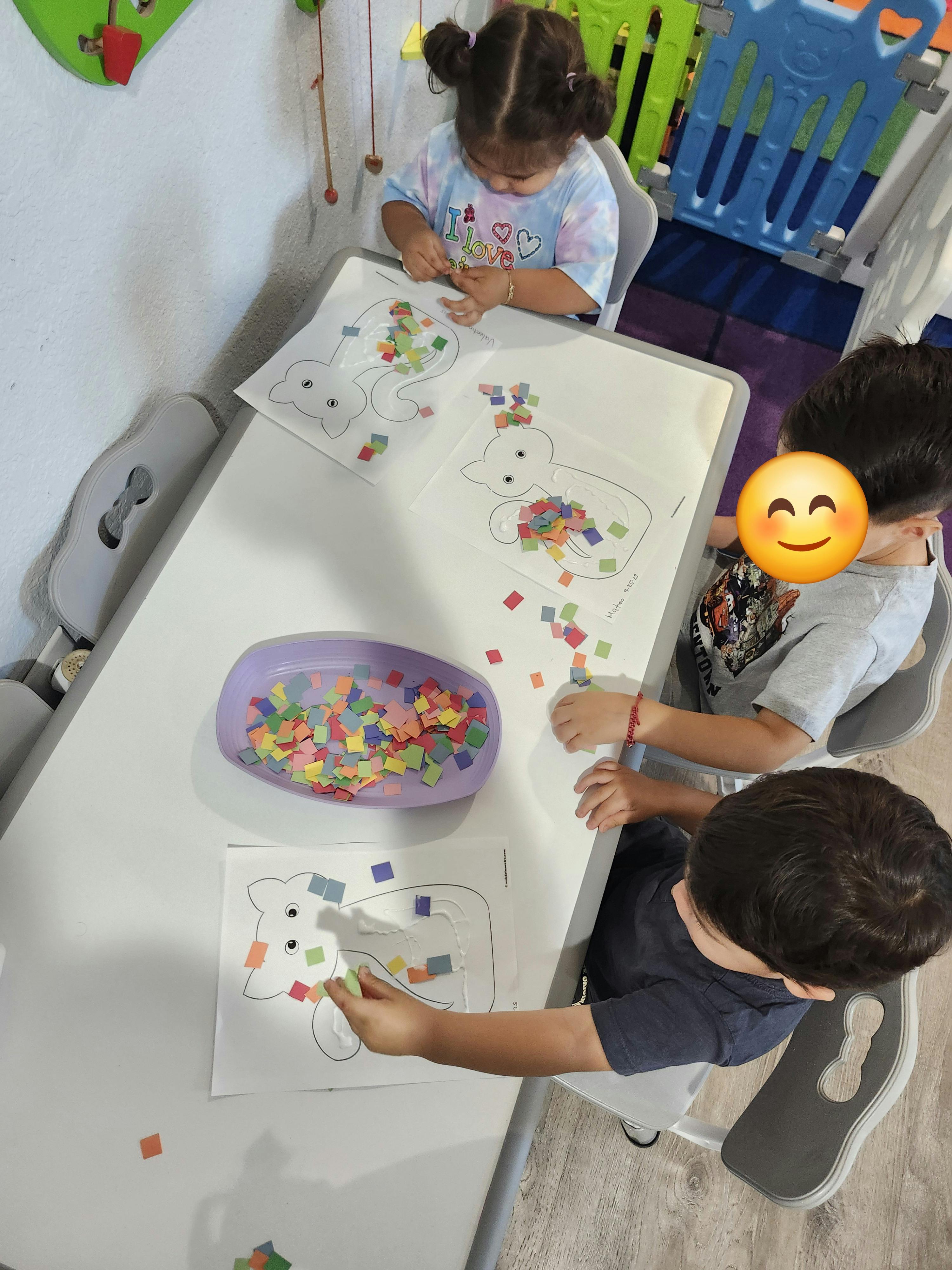 Children doing crafts at a table