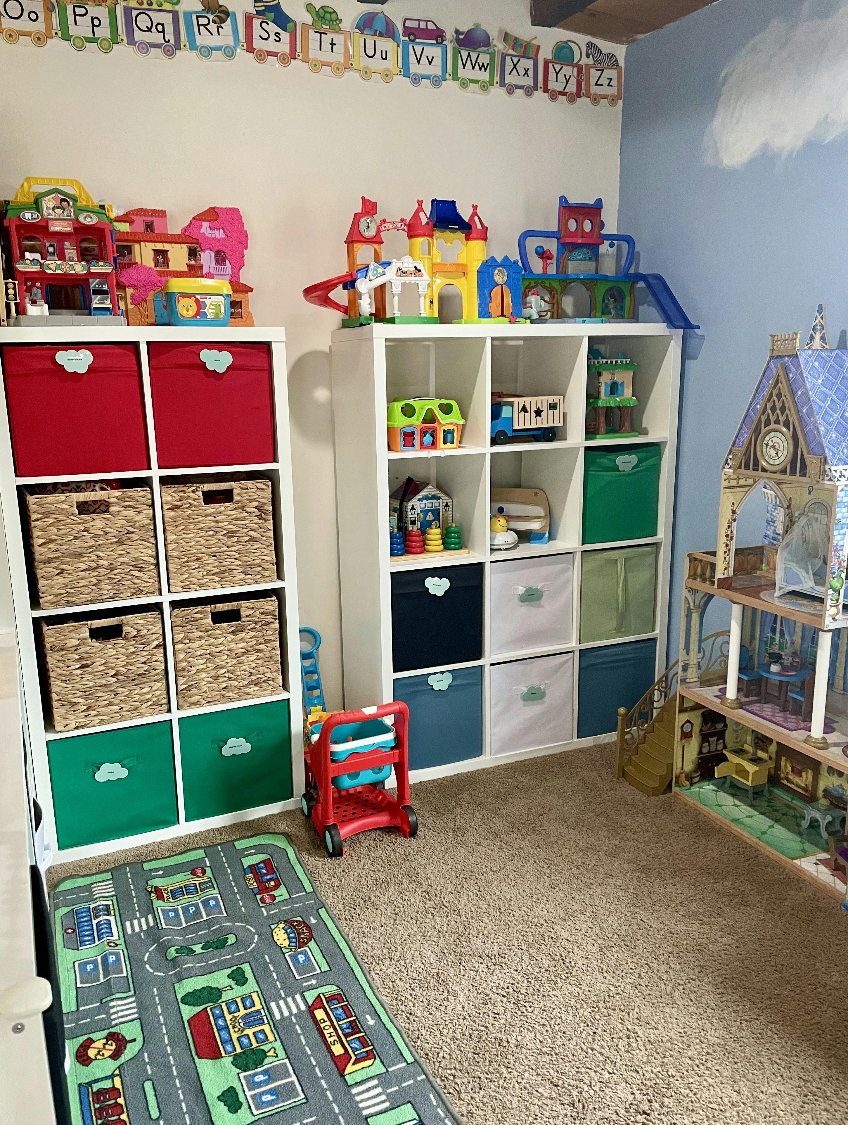Toy room with storage shelves, bins, and a play rug
