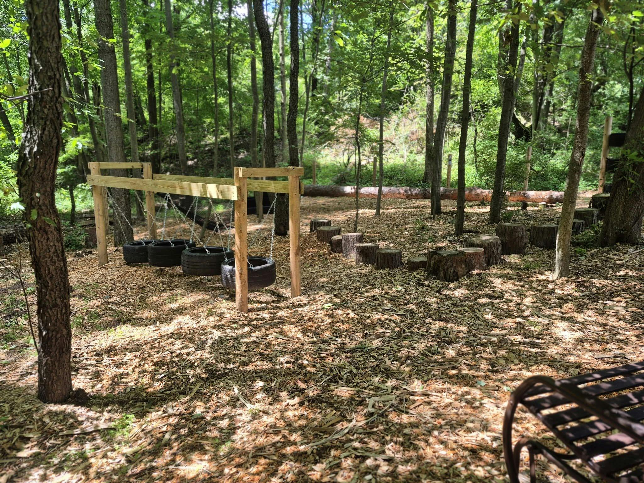 Wooden tire obstacle course in a forest