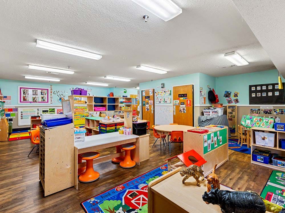 Classroom with child-sized furniture and colorful learning materials