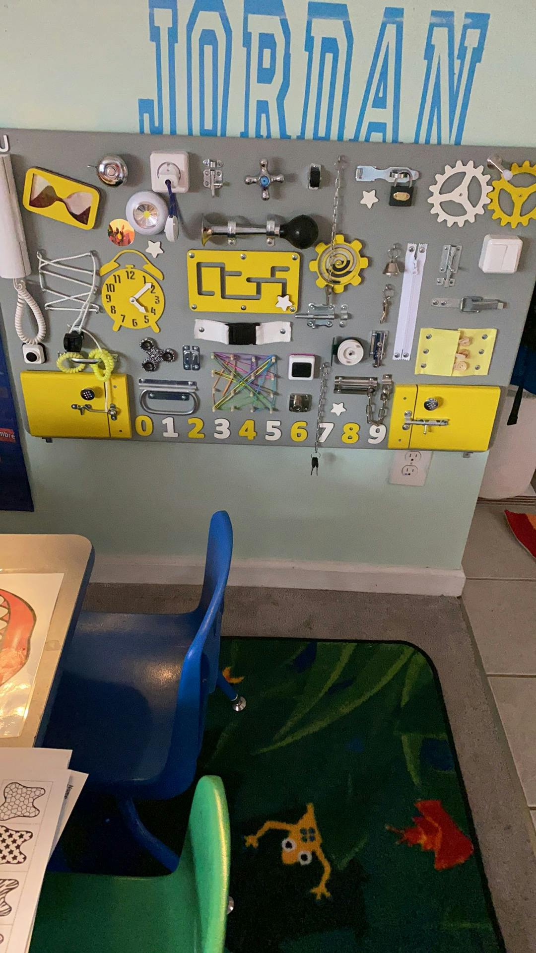 Busy board with various objects and numbers 0-9