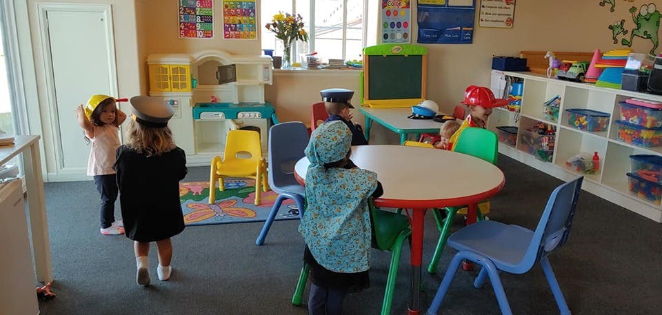Children playing in a classroom
