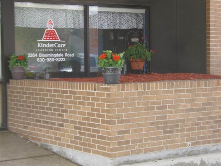 KinderCare Learning Center sign on a glass door