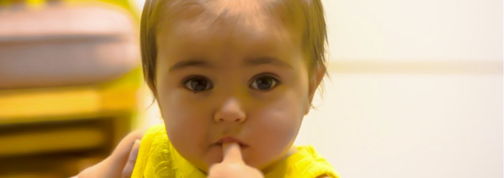 Child with finger in mouth