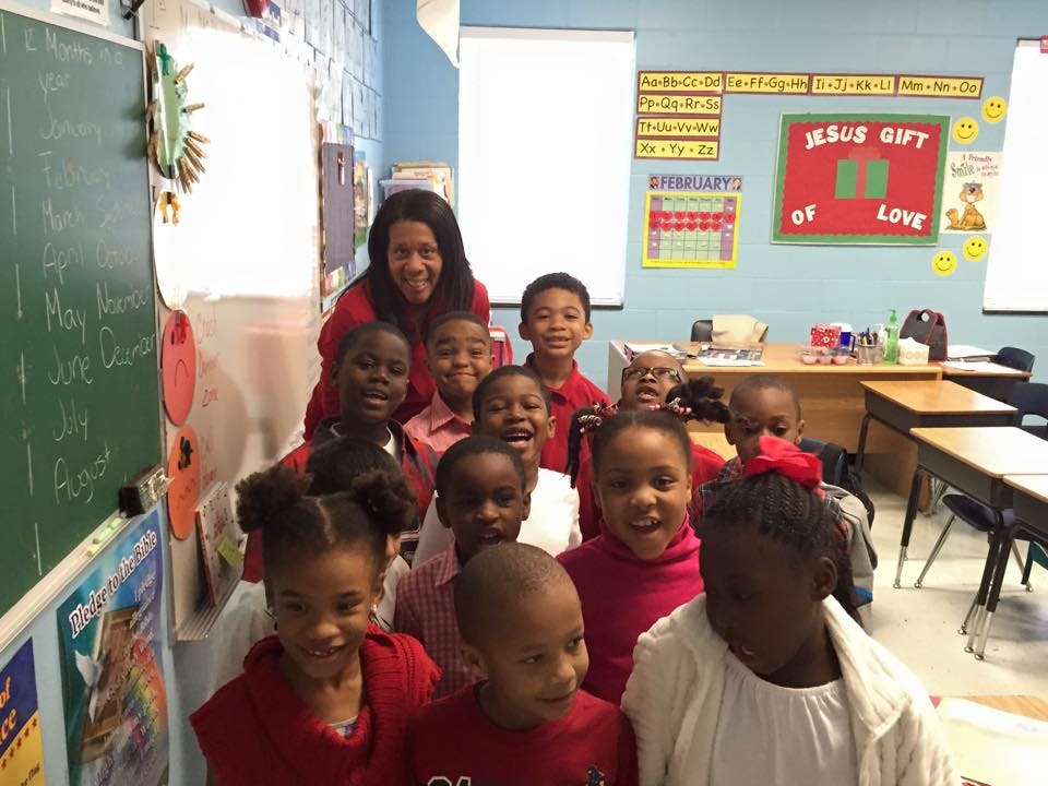 Adult and children in a classroom