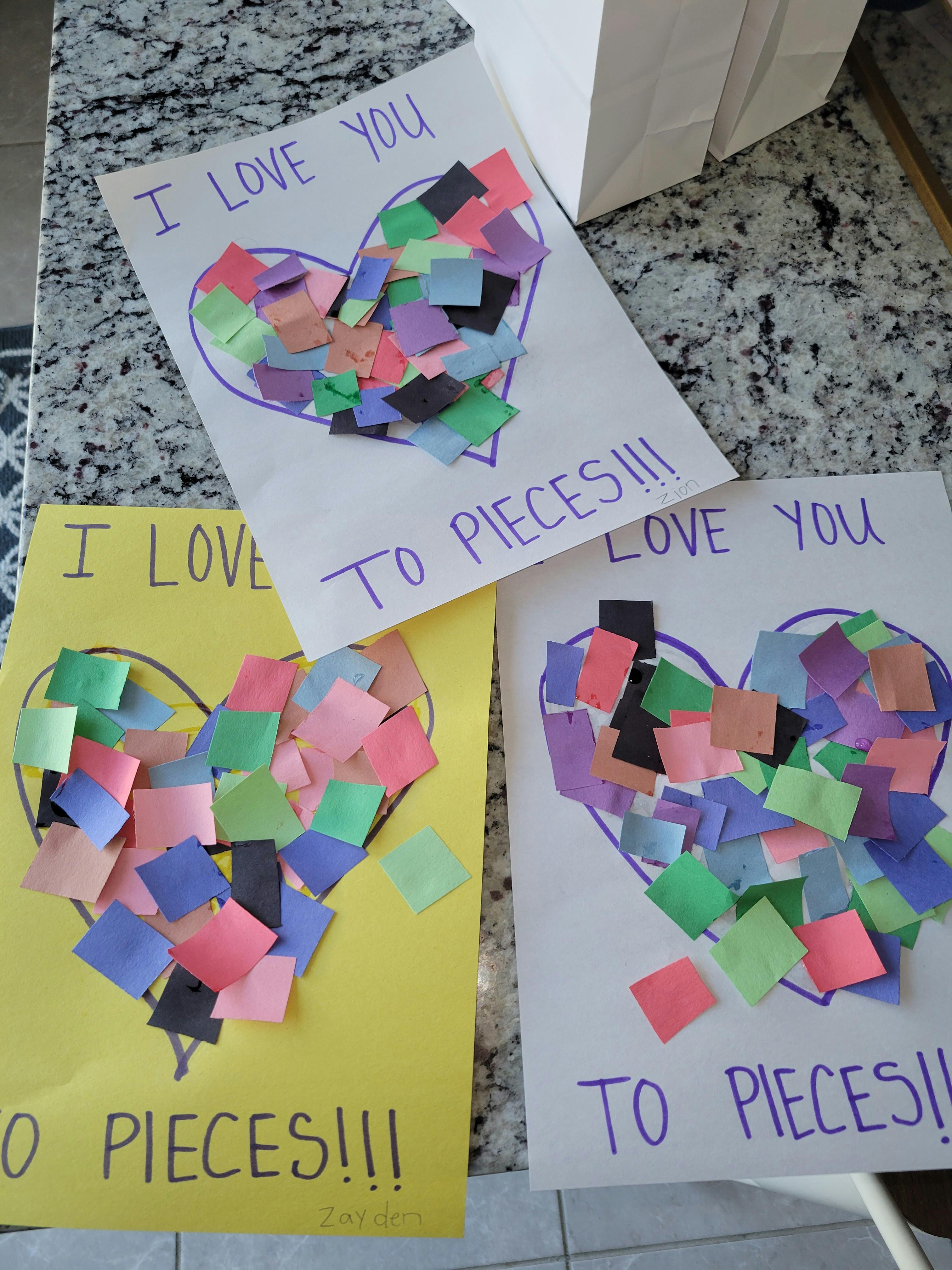 Three handmade cards with hearts filled with colorful paper squares, text "I love you to pieces"