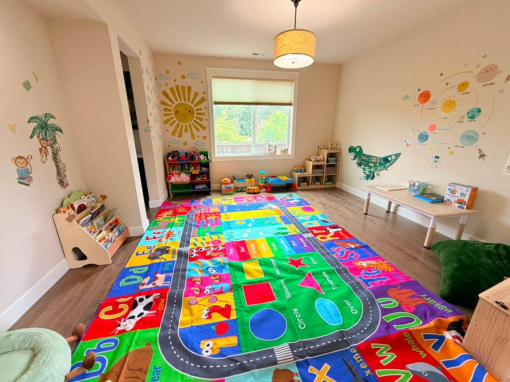 Colorful educational rug with letters and shapes in a children playroom