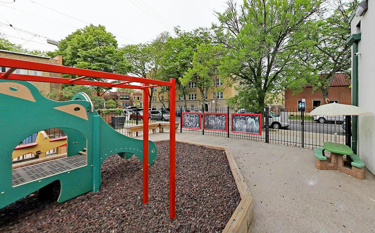 Playground equipment with a climbing structure and small outdoor table