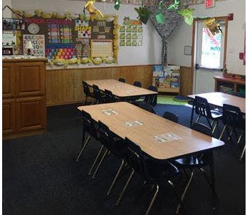Empty classroom with tables and chairs