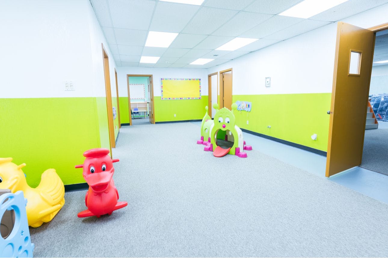 Playroom with plastic toys and lime green walls