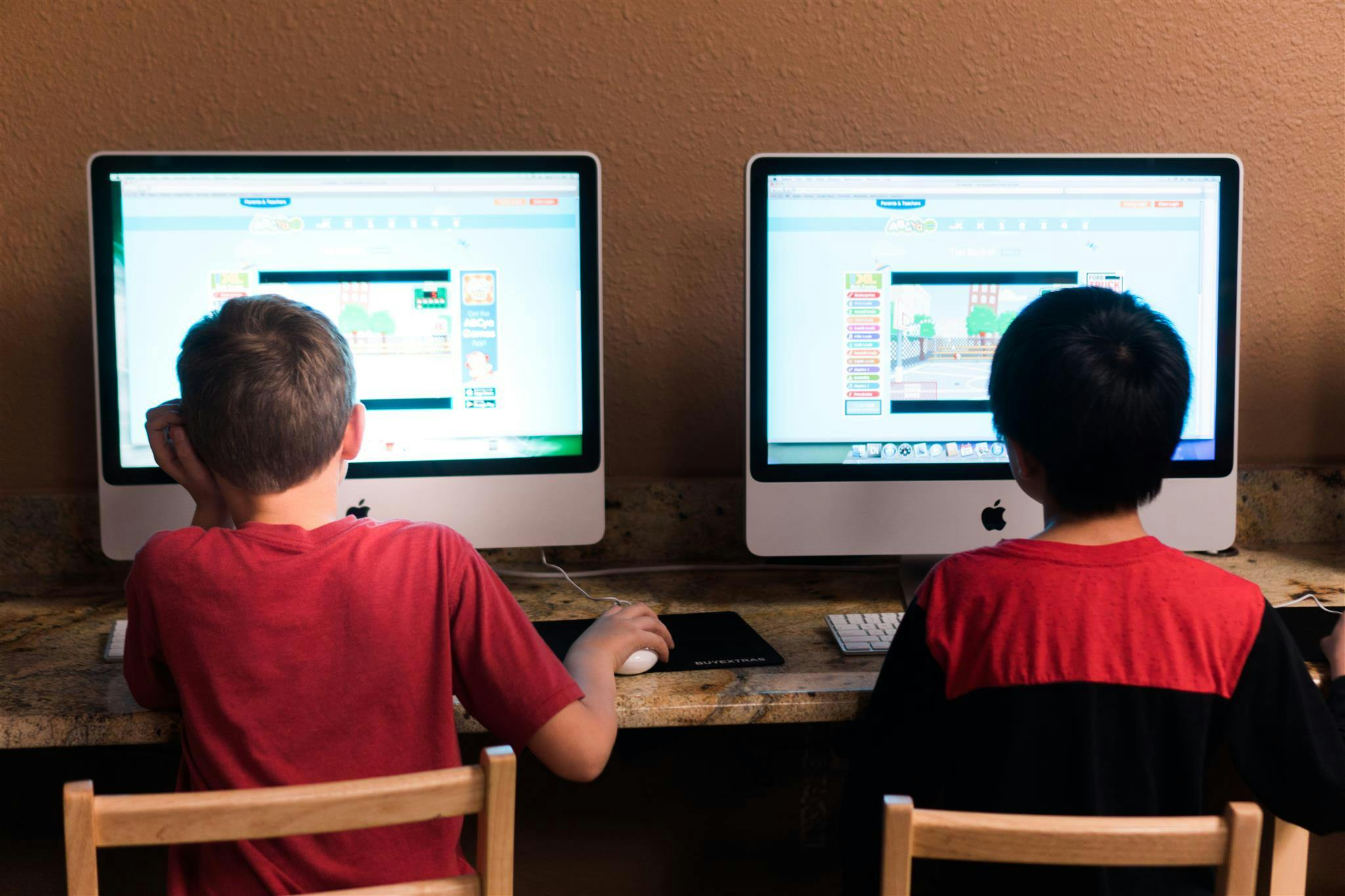 Two children sitting at computers