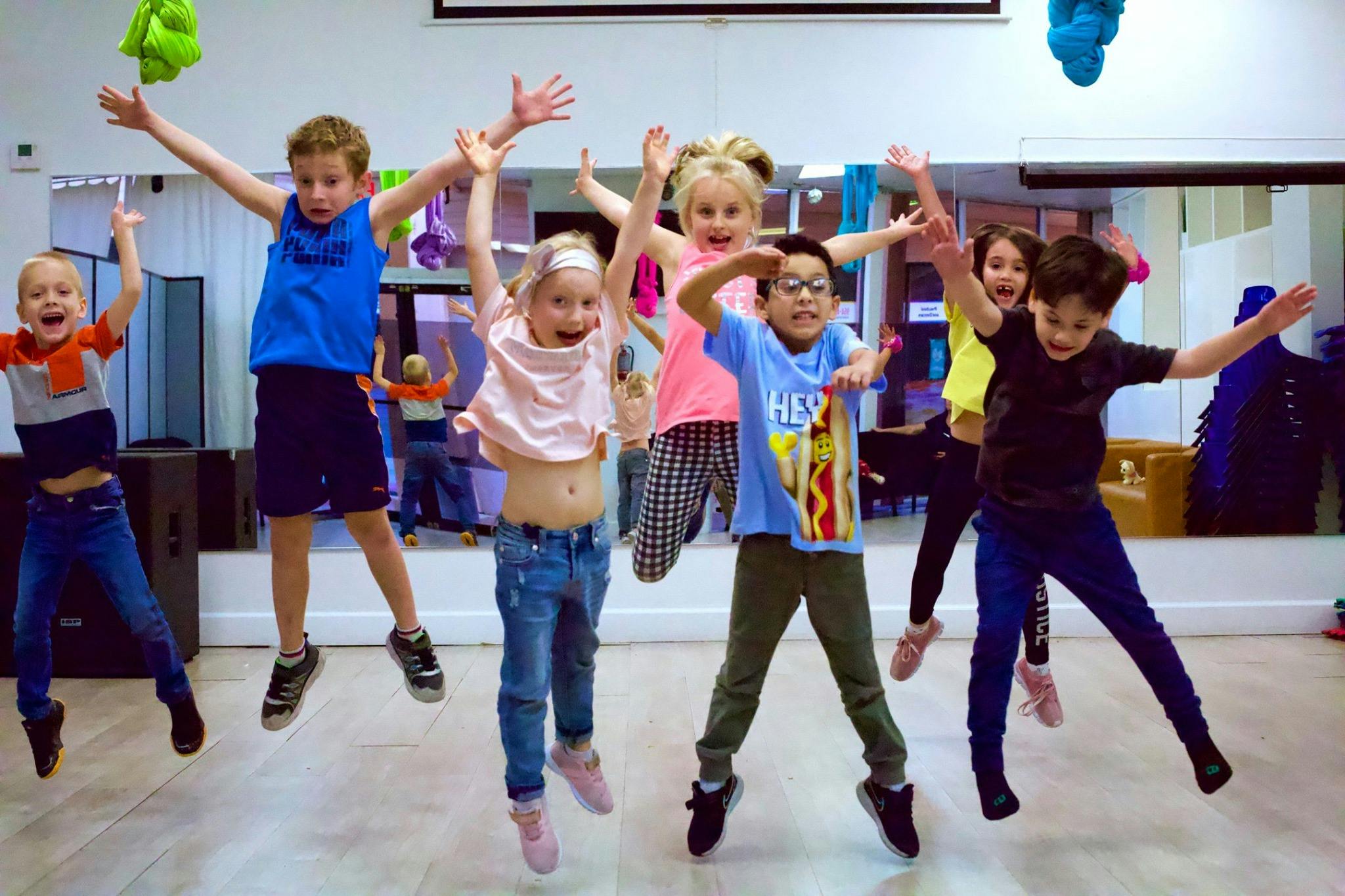 Group of children jumping in a room