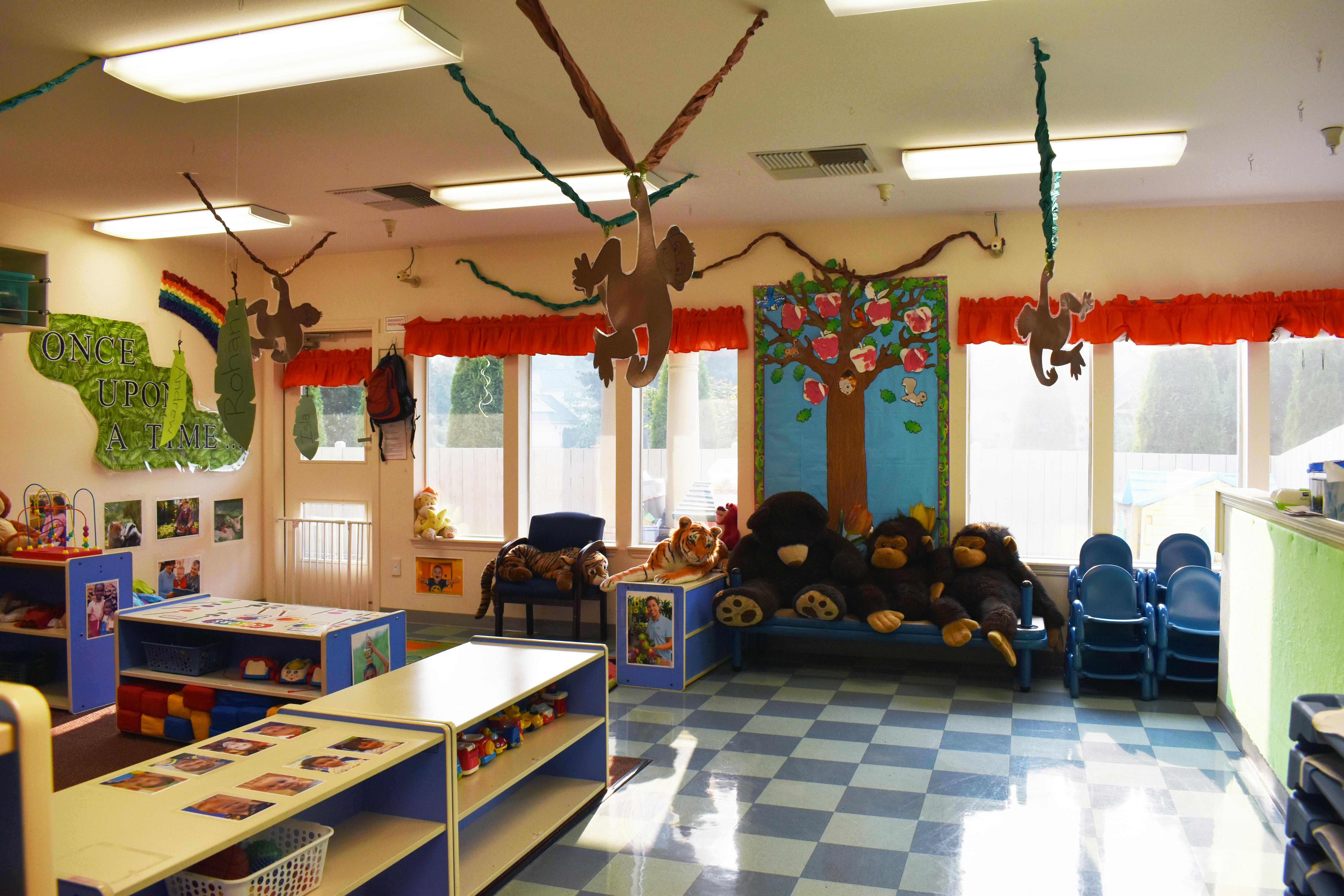 Classroom with tables, chairs, and stuffed animals