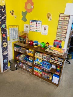 Shelves with toys and learning materials in a classroom