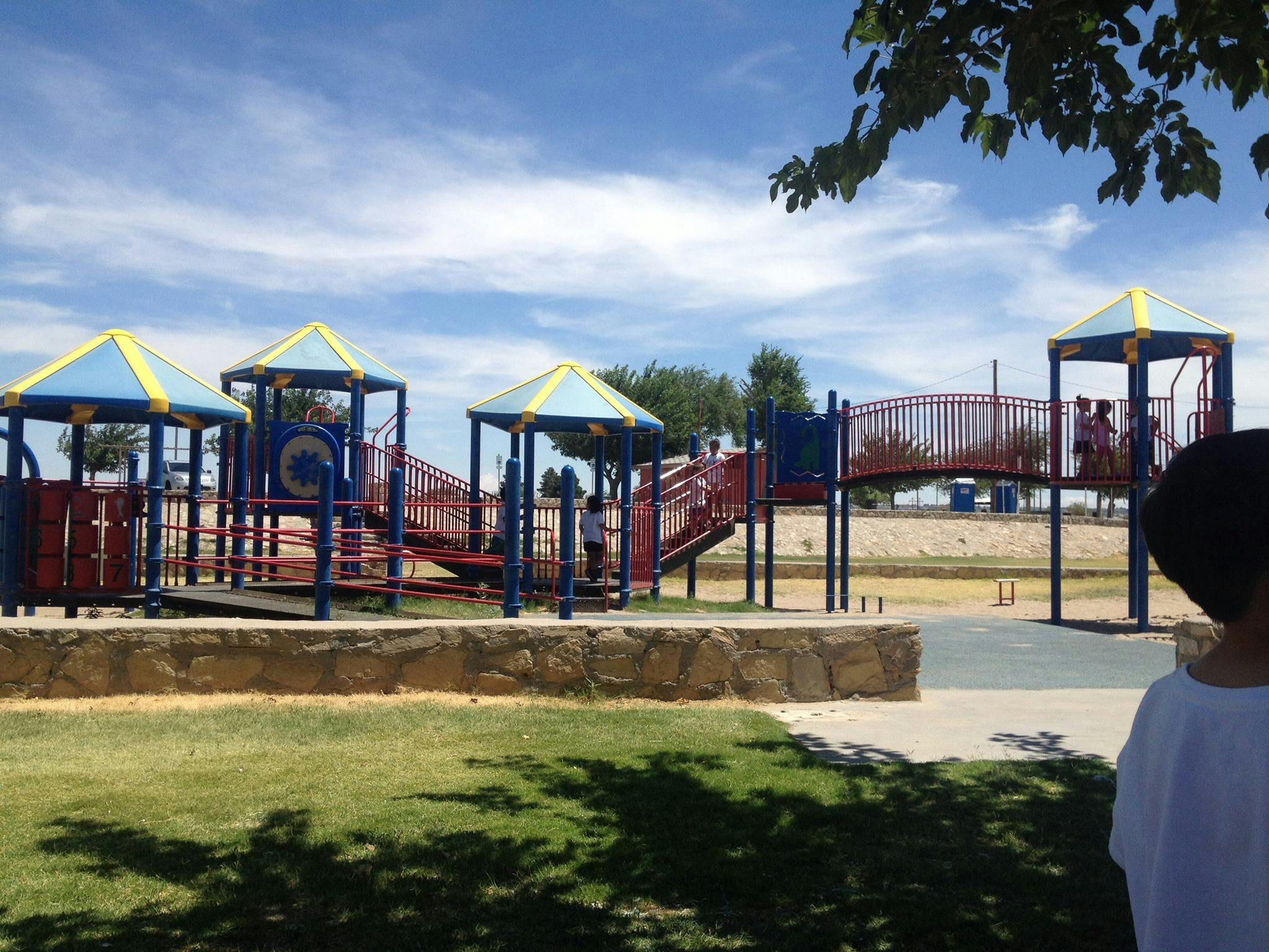 Playground structure with multiple levels and slides