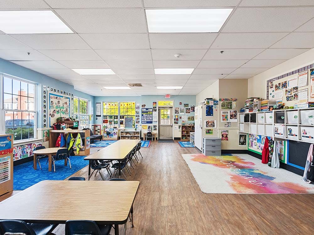 Classroom with tables, chairs, and learning materials