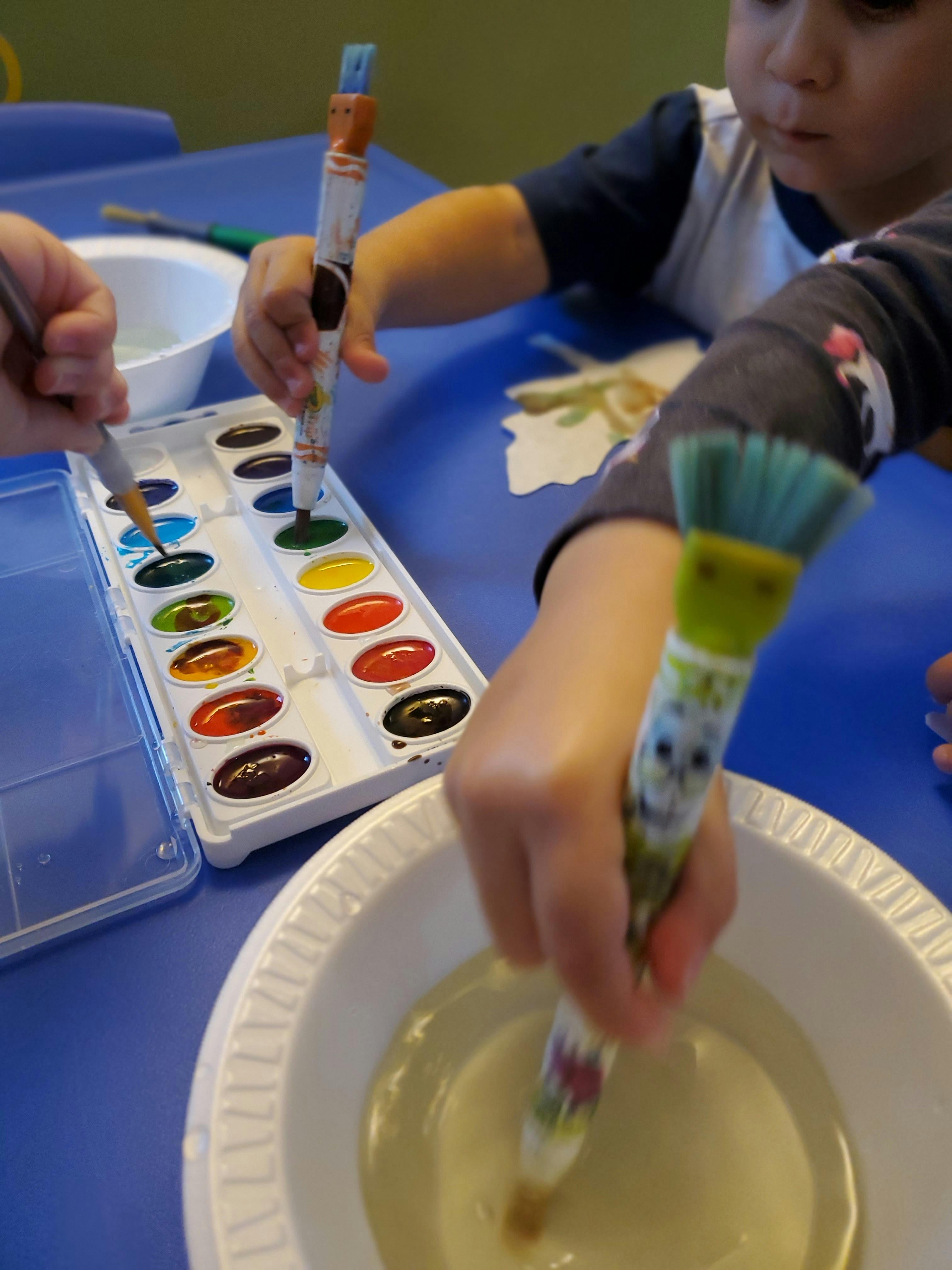 Children painting with watercolors