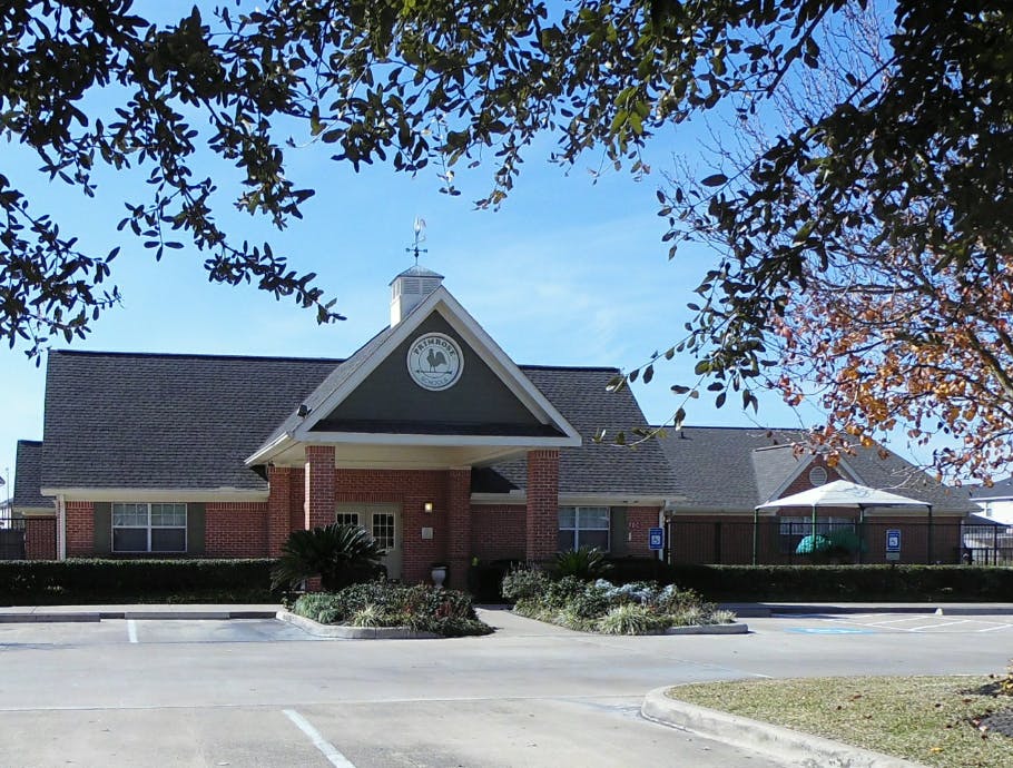 Building with a clock tower and a covered entrance