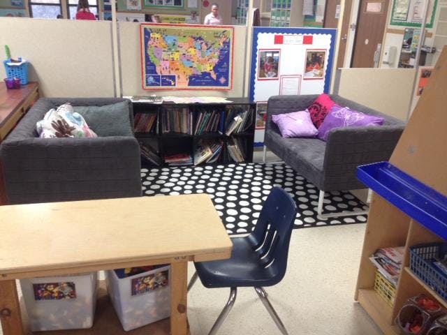 Classroom seating area with a map of the United States on the wall