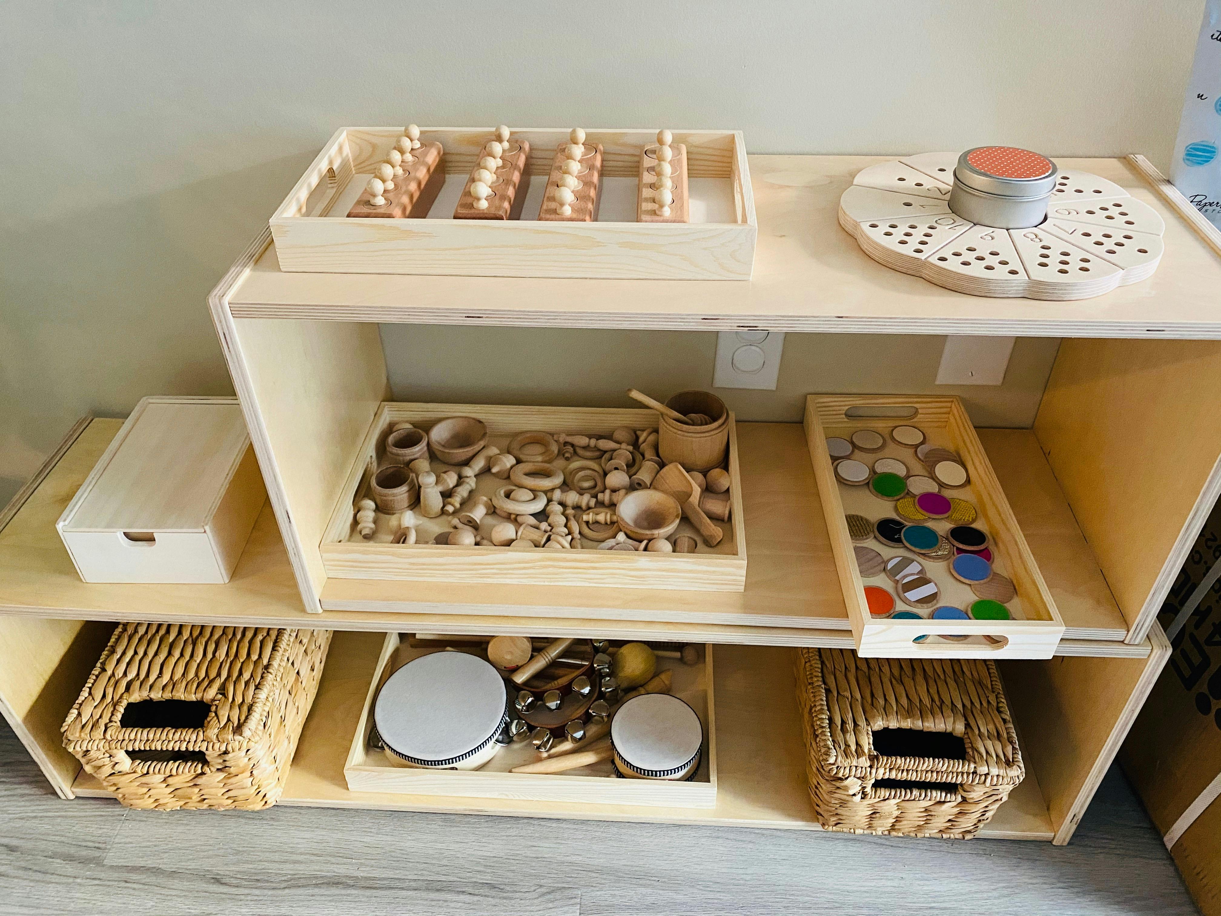 Wooden shelf with various Montessori-style learning materials