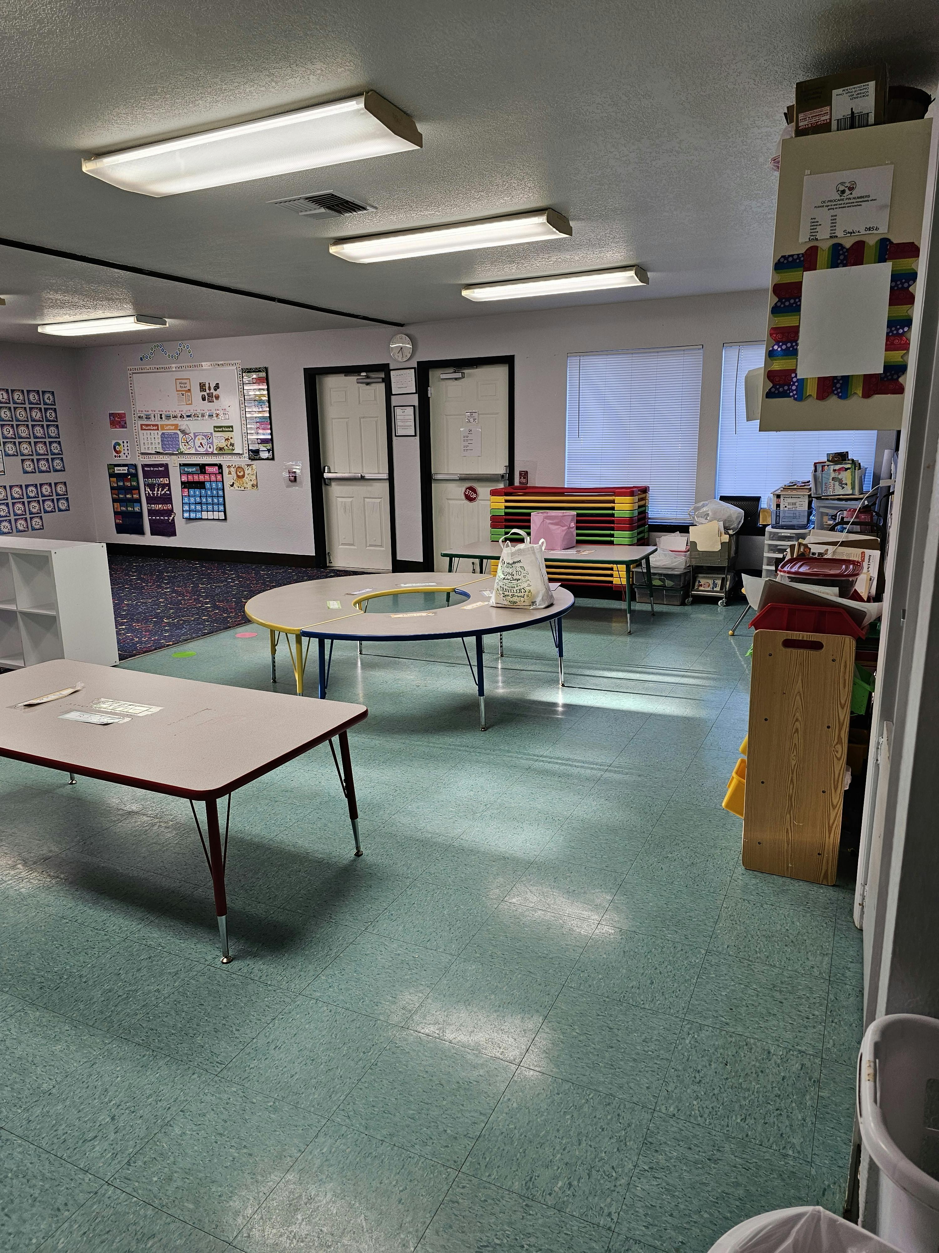 Classroom with tables and whiteboards