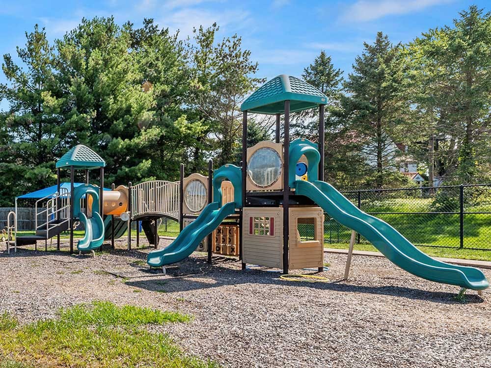 A colorful outdoor playground with slides and climbing structures