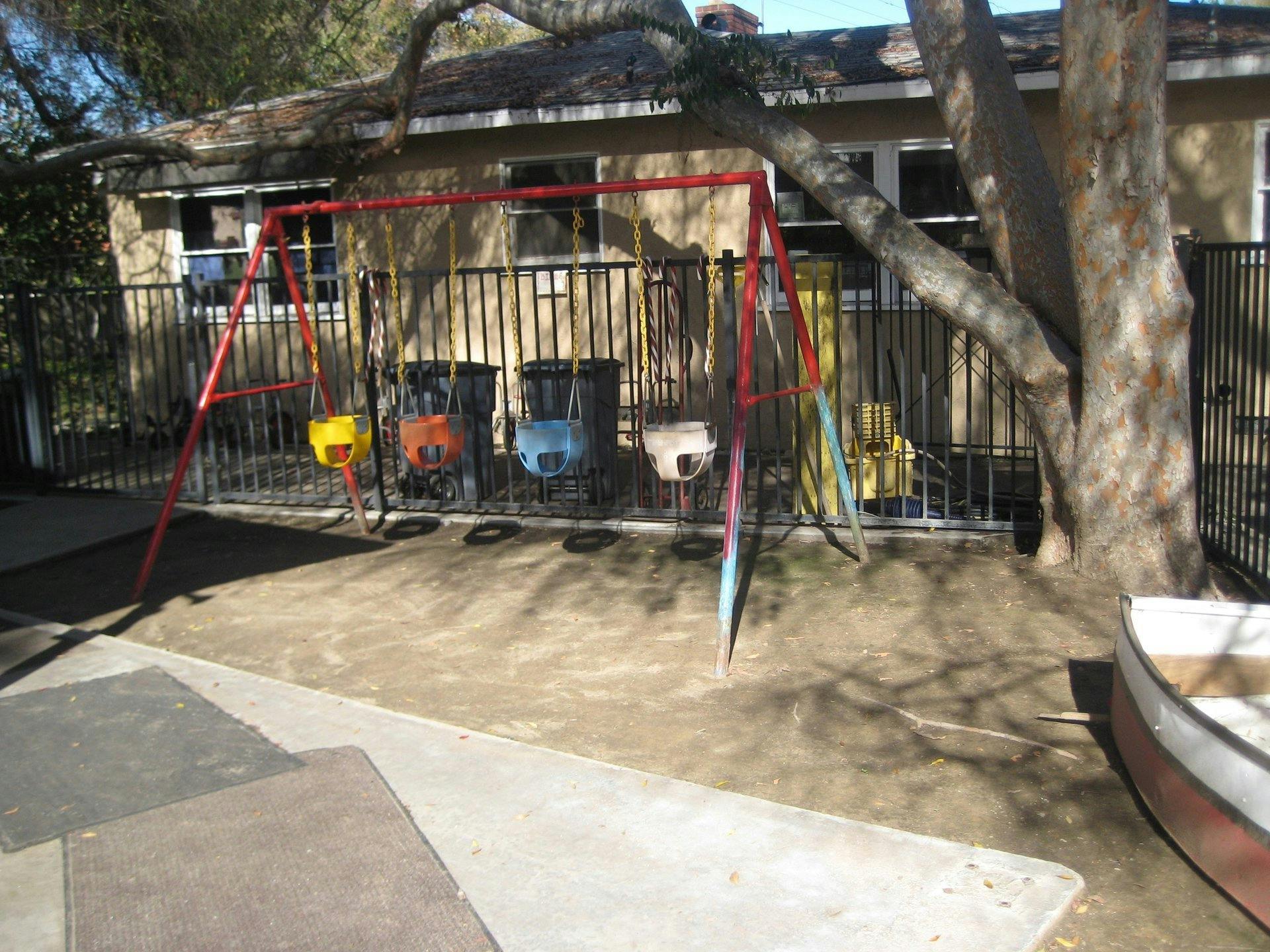 Swing set with multiple swings in a yard