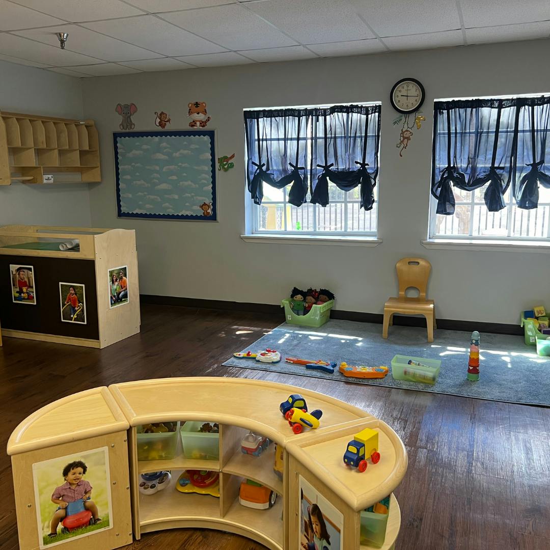 Classroom with toys, small furniture, and windows