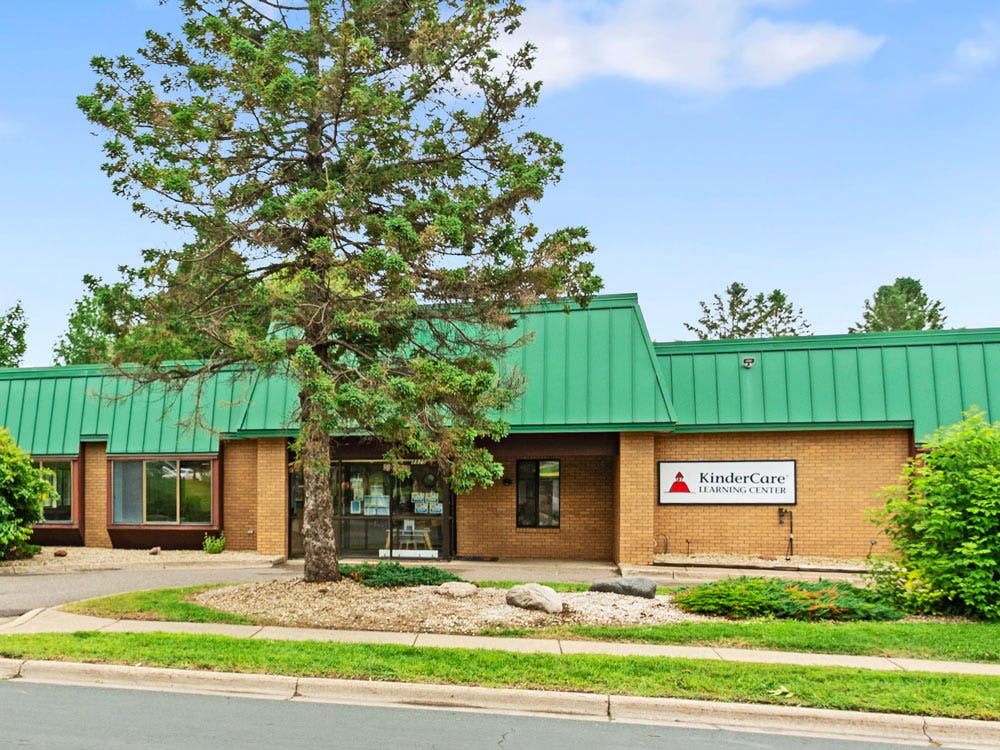 KinderCare Learning Center building with a green roof and brick facade