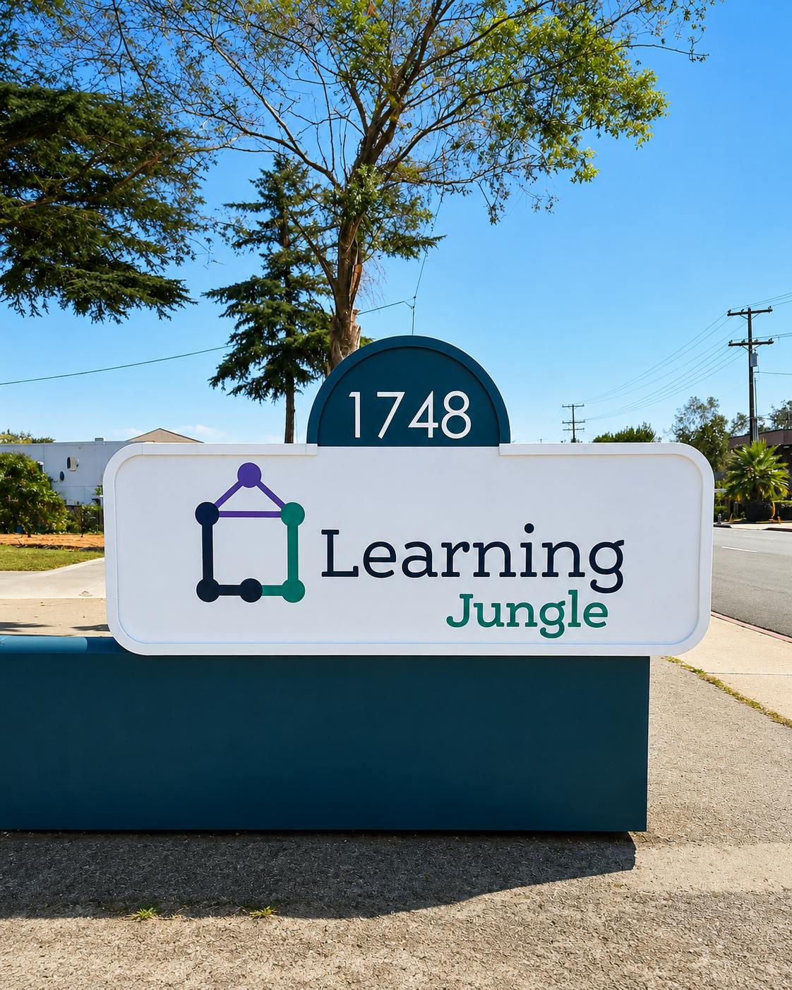 Sign displaying 1748 and Learning Jungle text