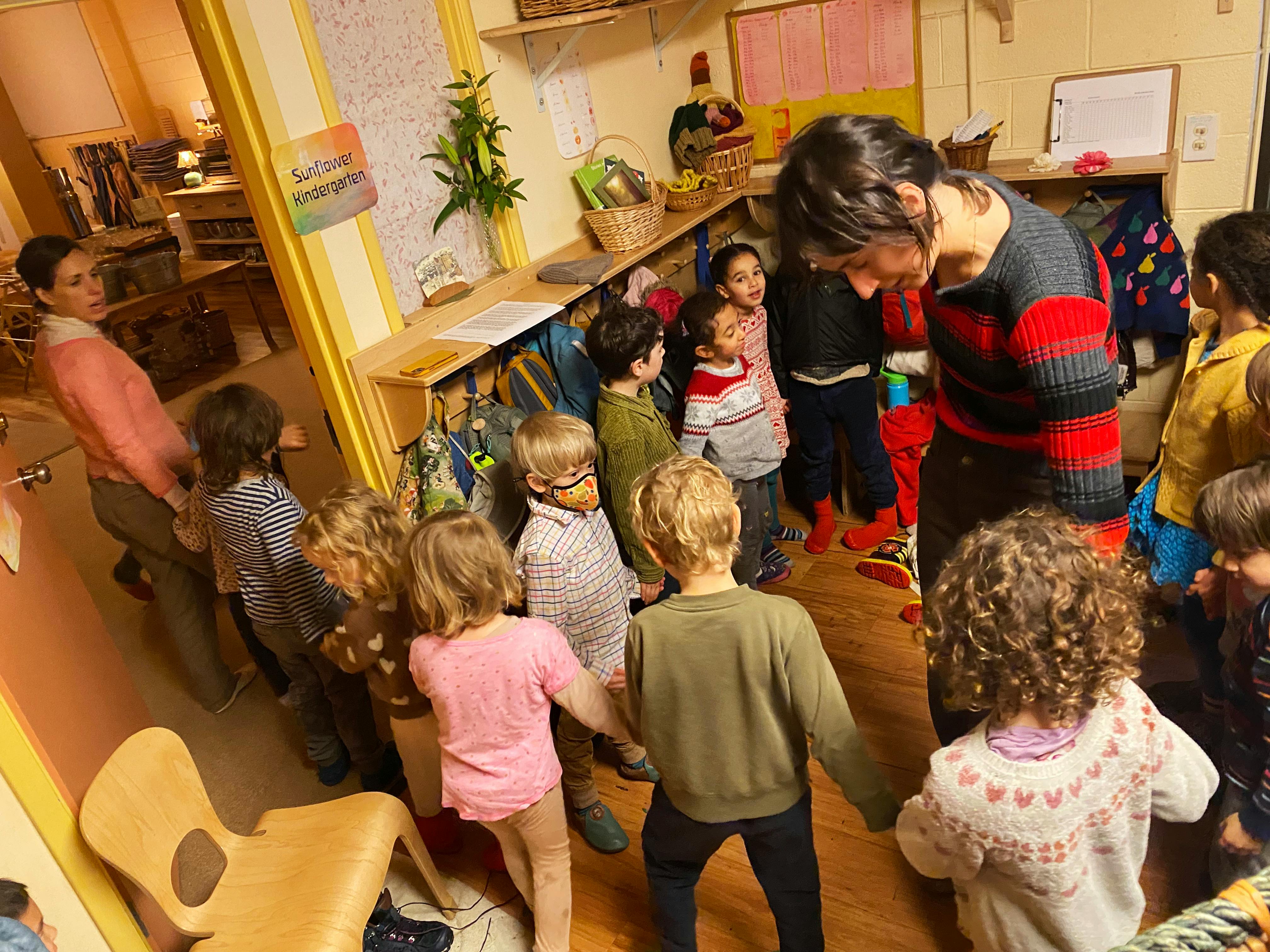 Adults and children in a classroom