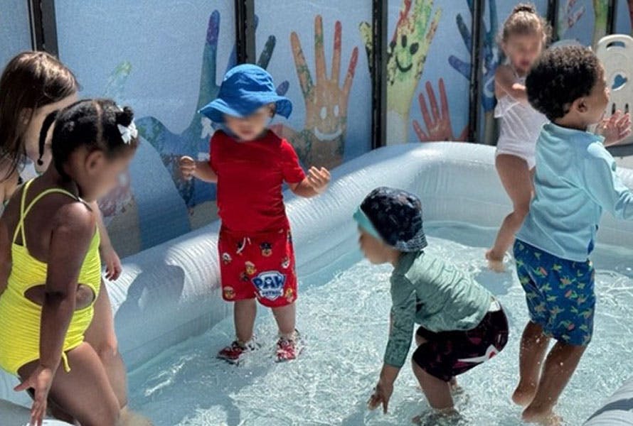 Group of children playing in an inflatable pool